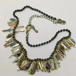 Premier Jewelry necklace with dark beads and gold, purple and white dangles.